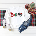 Believe Christmas Shirt - Long Sleeve Cotton T-Shirt with "Believe" Graphic, Ideal for Christmas Parties and Family...