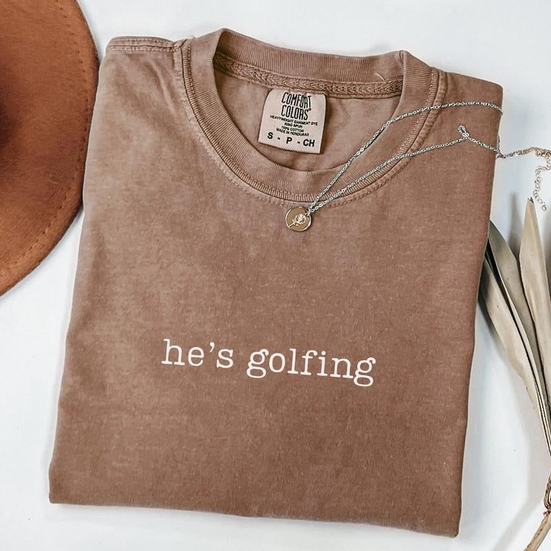 Comfort Colors He's Golfing Shirt, Golfer Wife Tee, Golf Player Shirt for Mom, Golf Season Tshirt, Golf Girlfriend Shirt,...