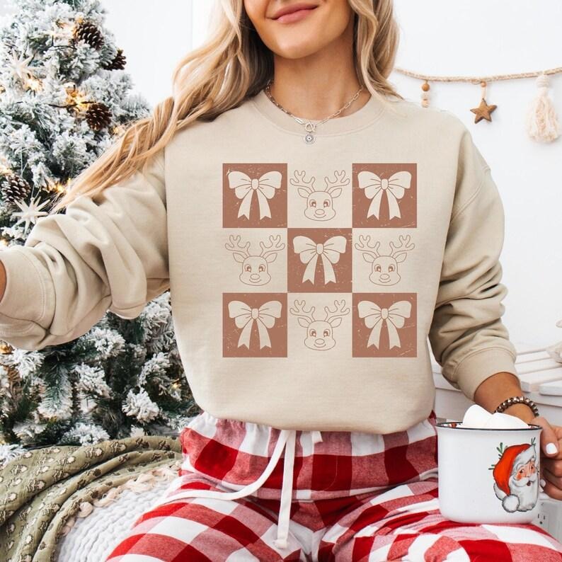 Coquette Bow Reindeer Christmas Sweatshirt, Checkered Reindeer T-shirt, Vintage Christmas Shirt, Christmas Vibes Hoodie,...