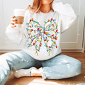 Coquette Christmas Light Bow Sweatshirt, Merry Christmas T-Shirt, Xmas Coquette Bow Holiday Clothing, Unisex Cotton...