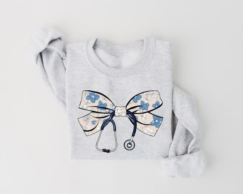 Coquette Floral Nurse Bow Sweatshirt, Stethoscope Bow Shirt, Nurse Coquette Shirt, Gift for Nurse, Nurse Appreciation,...