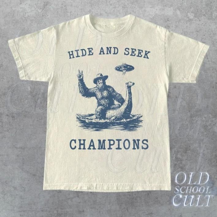 Hide And Seek Ufo Tshirt, Retro Bigfoot Shirt, Bigfoot Riding Dinosaur Shirt Hoodie, Sweatshirt | CiraTrend.com