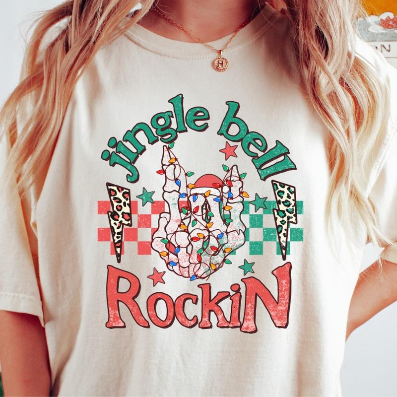 JINGLE BELL ROCKIN SKELETON T-SHIRT (COMFORT COLORS T-SHIRT, CASUAL SHIRT UNISEX, CHRISTMAS CLOTHING, GRAPHIC APPAREL, HOLIDAY SHIRT) Cotton Fabric
