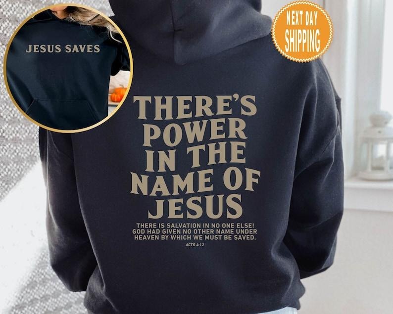 There's Power In The Name Of Jesus Hoodie, There's Power In The Name Of Jesus Shirt, Trendy Faith Shirt, Jesus Saves  T-shirt, sweater and Hoodie