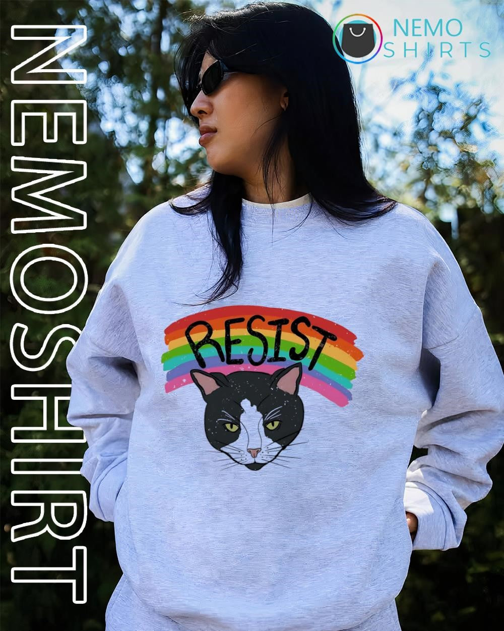 Tuxedo cat under rainbow LGBT pride shirt